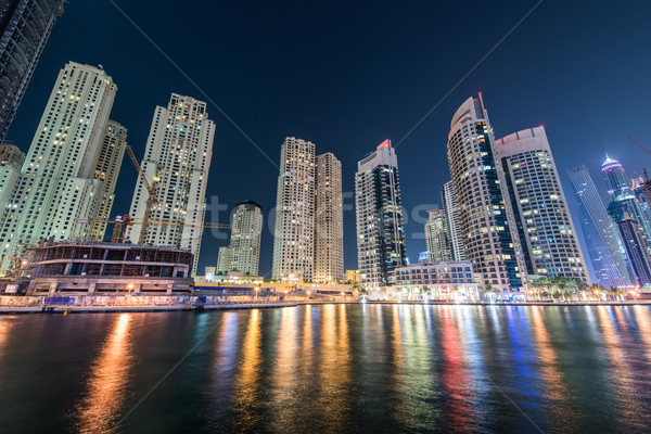 Dubai marina skyscrapers during night hours Stock photo © Elnur