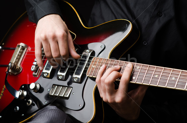 Stock photo: Man with guitar during concert