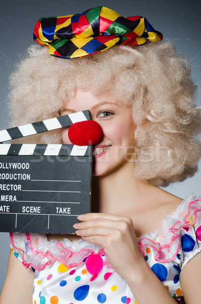 Clown with movie clapper board Stock photo © Elnur