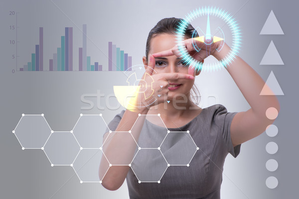 Businesswoman pressing virtual buttons in business concept Stock photo © Elnur