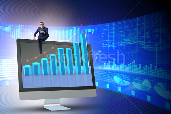 Businessman in economic forecasting concept with charts Stock photo © Elnur