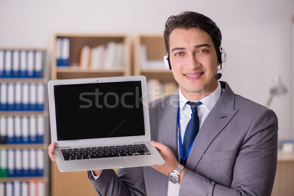 Handsome customer service clerk with headset  Stock photo © Elnur