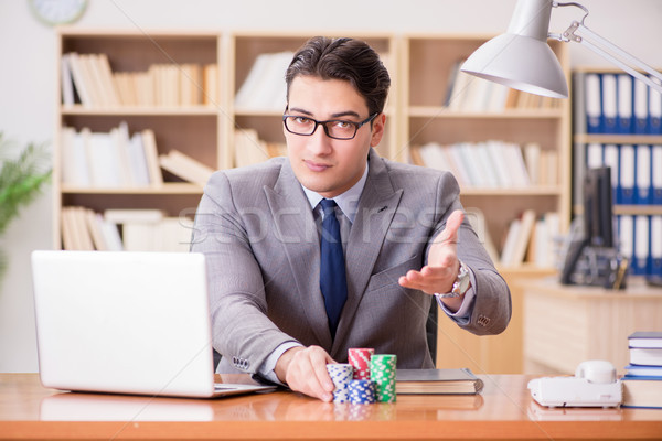 Businessman gambling playing cards at work Stock photo © Elnur