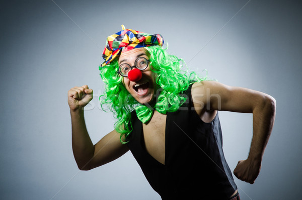 Funny clown against the dark background Stock photo © Elnur