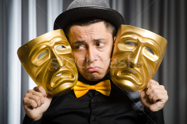 Funny concept with theatrical mask Stock photo © Elnur