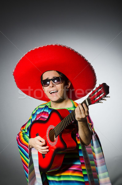 Man in red sombrero playing guitar Stock photo © Elnur