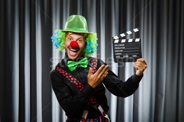 Clown with movie clapper board Stock photo © Elnur