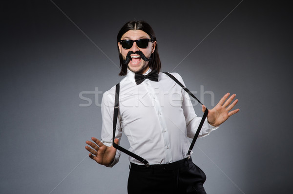 Man with moustache and sunglasses against gray Stock photo © Elnur