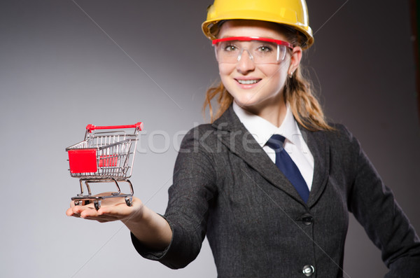 Construction worker in helmet against gray Stock photo © Elnur