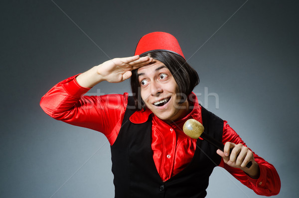 Man wearing red fez hat Stock photo © Elnur