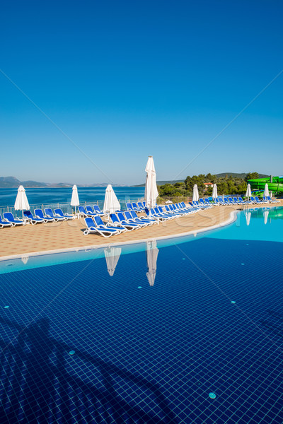 Nice swimming pool outdoors on bright summer day Stock photo © Elnur