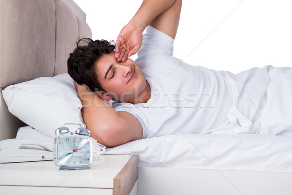 Człowiek bed cierpienie bezsenność spać biały Zdjęcia stock © Elnur