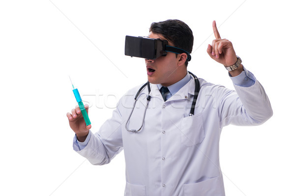 Doctor wearing a vr virtual reality headset isolated on white ba Stock photo © Elnur
