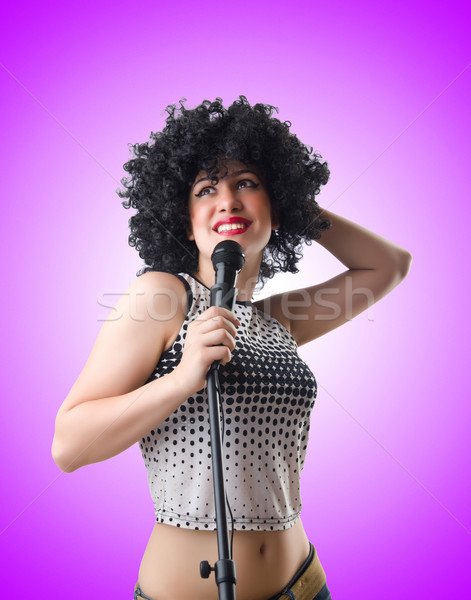Pop star with mic  on white Stock photo © Elnur