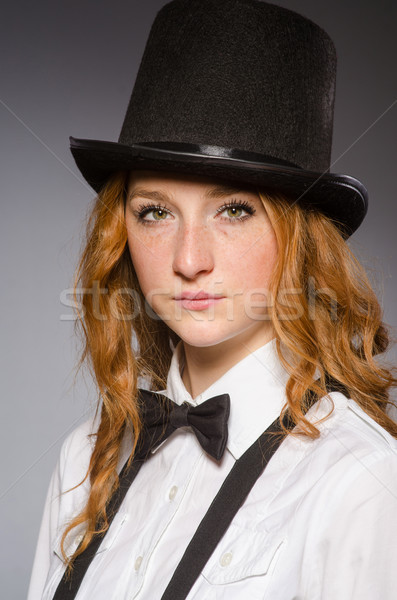 Pretty girl wearing retro hat isolated on gray Stock photo © Elnur