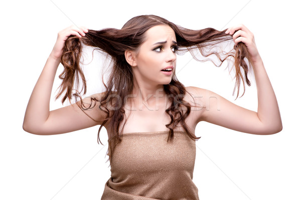 Woman checking her haircut isolated on white Stock photo © Elnur