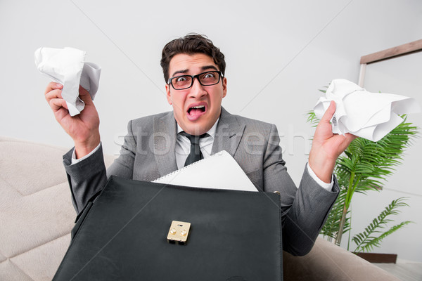 Angry businessman with crumbled paper Stock photo © Elnur