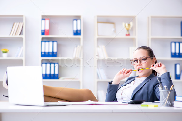 Stock photo: Businesswoman working in the office at desk