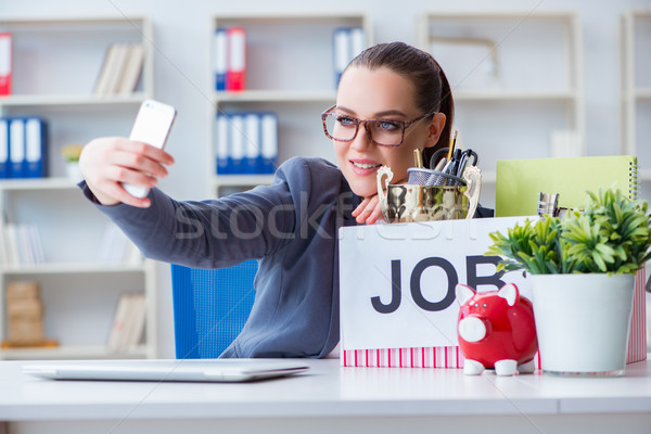 Businesswoman taking selfie on last day in office Stock photo © Elnur