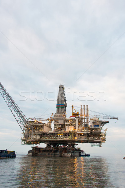 Oil rig being tugged in the sea Stock photo © Elnur