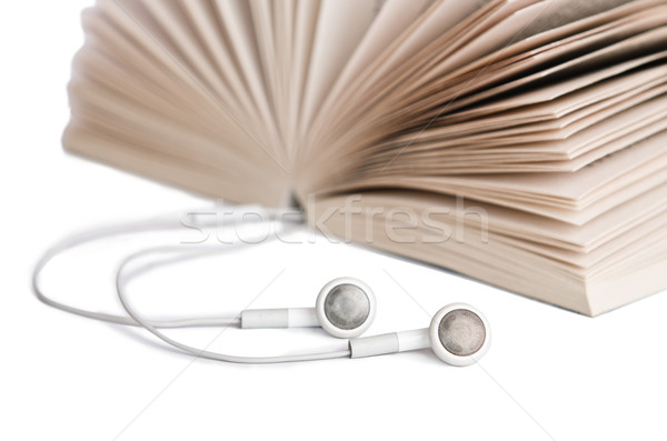 Concept of audio books with earphones on white Stock photo © Elnur