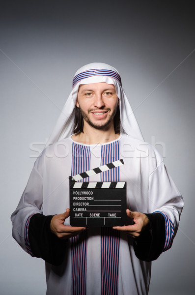 Arab businessman with movie board Stock photo © Elnur