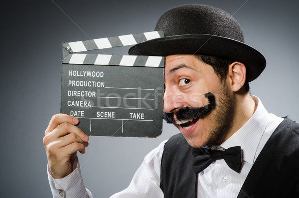 Funny man with movie clapper board  Stock photo © Elnur