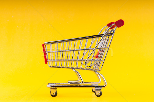 Shopping cart on seamless background Stock photo © Elnur