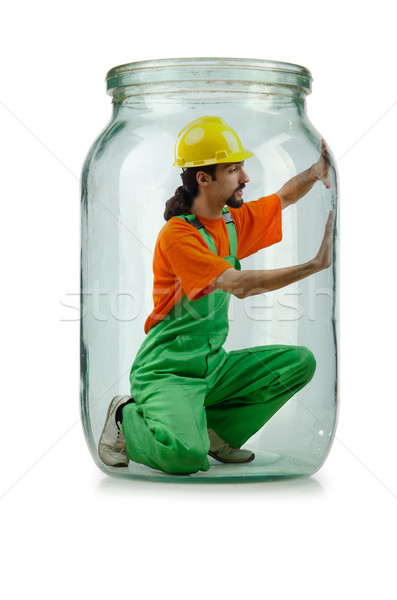 Man in coveralls imprisoned in glass jar Stock photo © Elnur