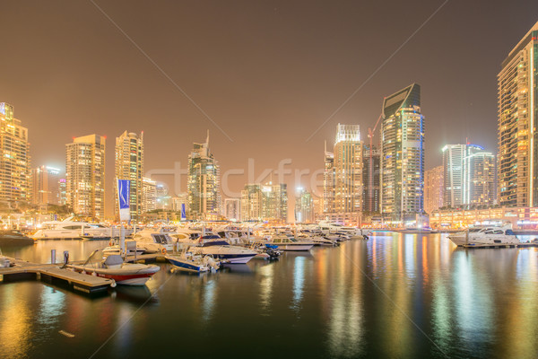 Dubai marina skyscrapers during night hours Stock photo © Elnur