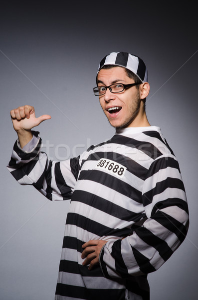 Young prisoner against gray Stock photo © Elnur