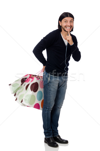 Young man holding plastic bags isolated on white Stock photo © Elnur