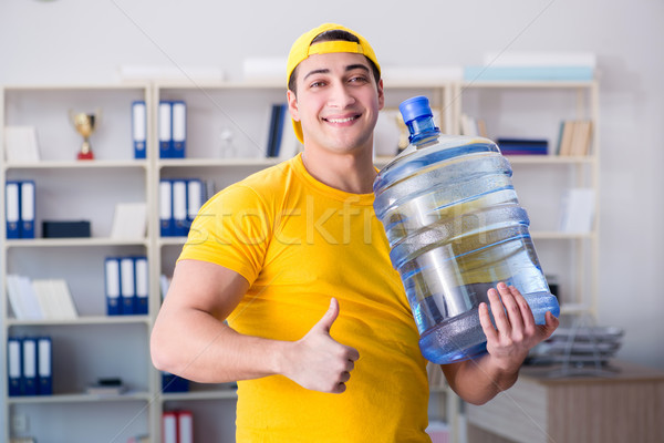 Homme une bouteille d'eau bureau affaires eau maison [[stock_photo]] © Elnur