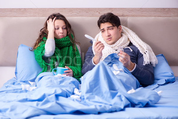 Sick wife and husband in bed in home Stock photo © Elnur