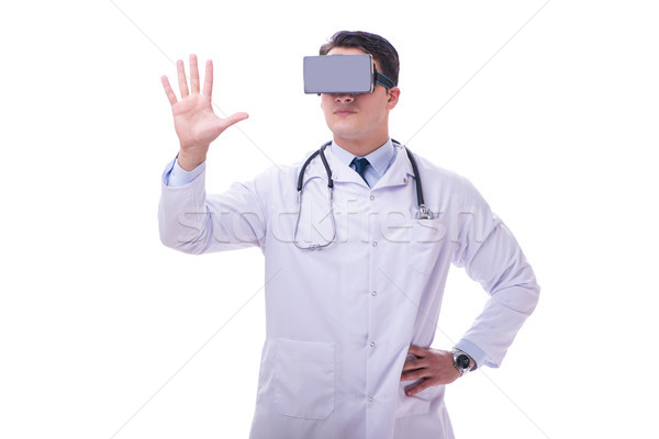 Doctor wearing a vr virtual reality headset isolated on white ba Stock photo © Elnur