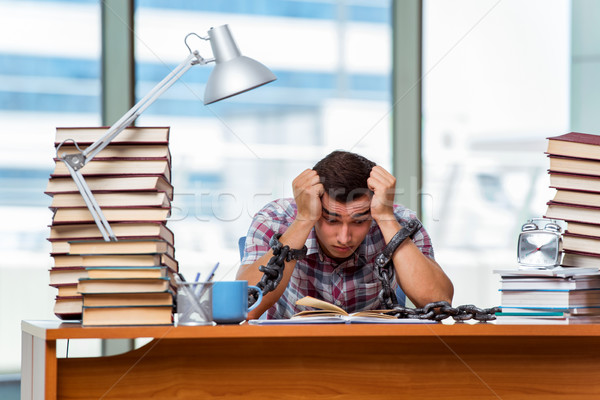 Stock photo: Young man preparing for graduation exams in college