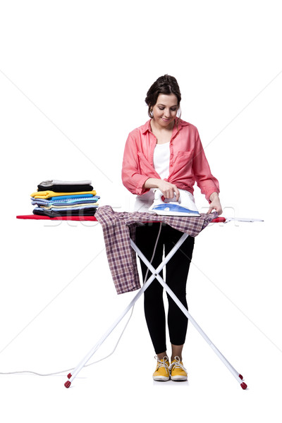 Young woman doing ironing isolated on white Stock photo © Elnur
