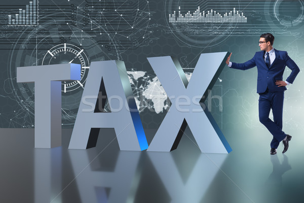Businessman in high taxes concept Stock photo © Elnur
