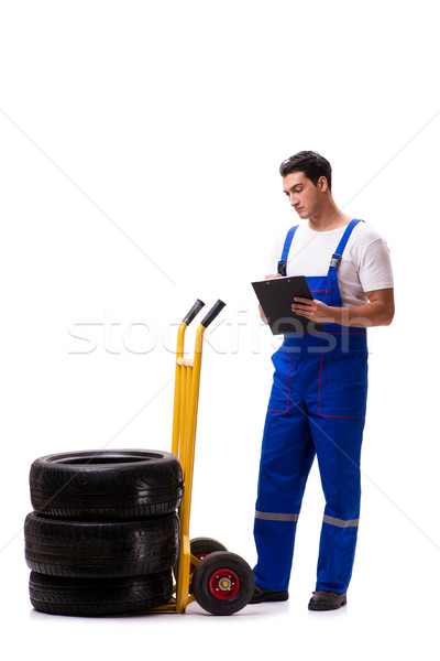 Handsome tyre repairman isolated on white Stock photo © Elnur