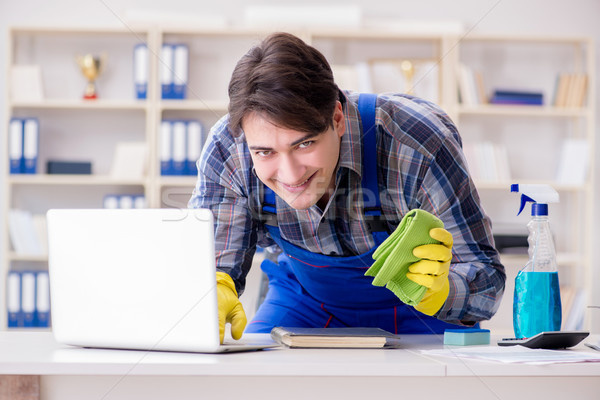 Stock photo: Hacker under cleaner cover stealing personal data