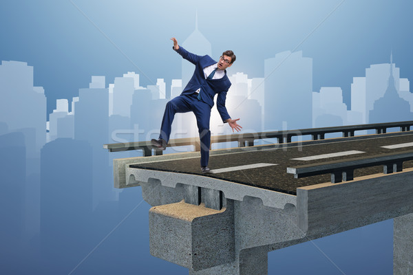 Businessman in uncertainty concept with broken bridge Stock photo © Elnur