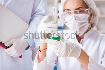 Blood testing in the lab with young scientist Stock photo © Elnur