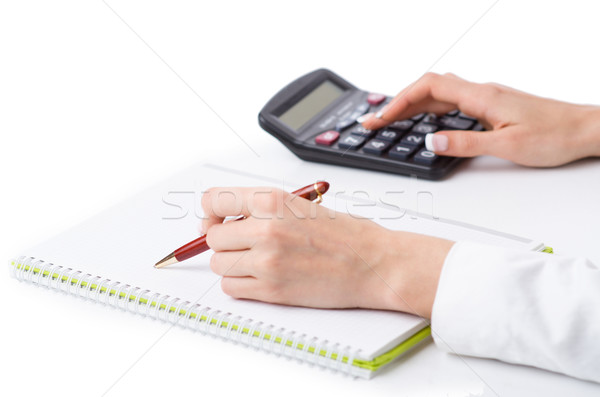 Stock photo: Hands working on the calculator