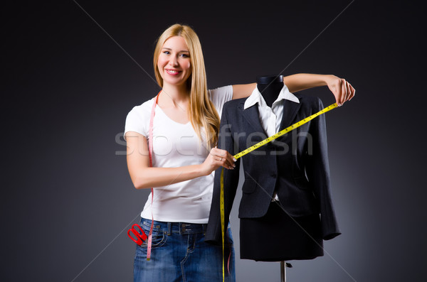Young tailor isolated on the white Stock photo © Elnur