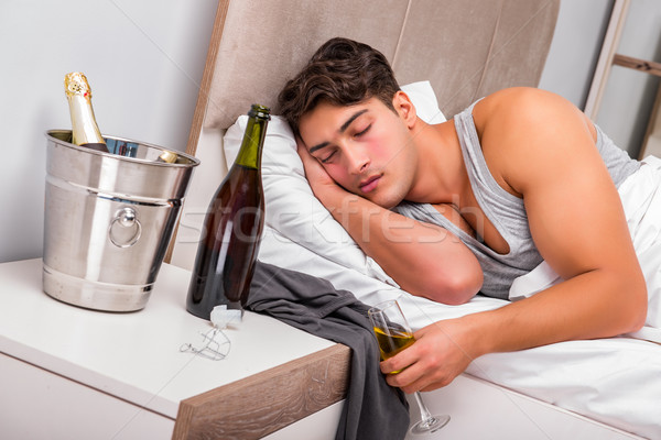 Man in the bed after party - Hangover concept Stock photo © Elnur