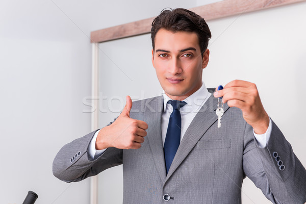 Real estate agent with key from new house Stock photo © Elnur