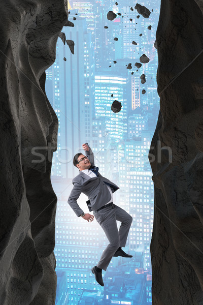 Businessman overcoming challenges in business concept Stock photo © Elnur