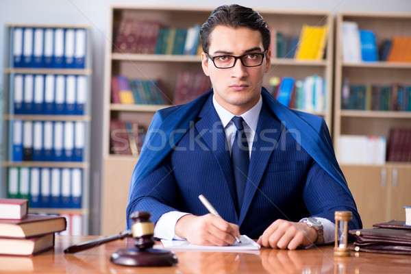 Handsome judge with gavel sitting in courtroom Stock photo © Elnur