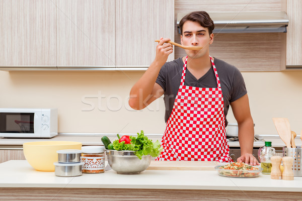 Man male cook preparing food in kitchen Stock photo © Elnur