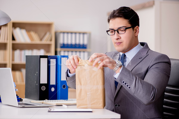 Businessman receiving parcel in office Stock photo © Elnur